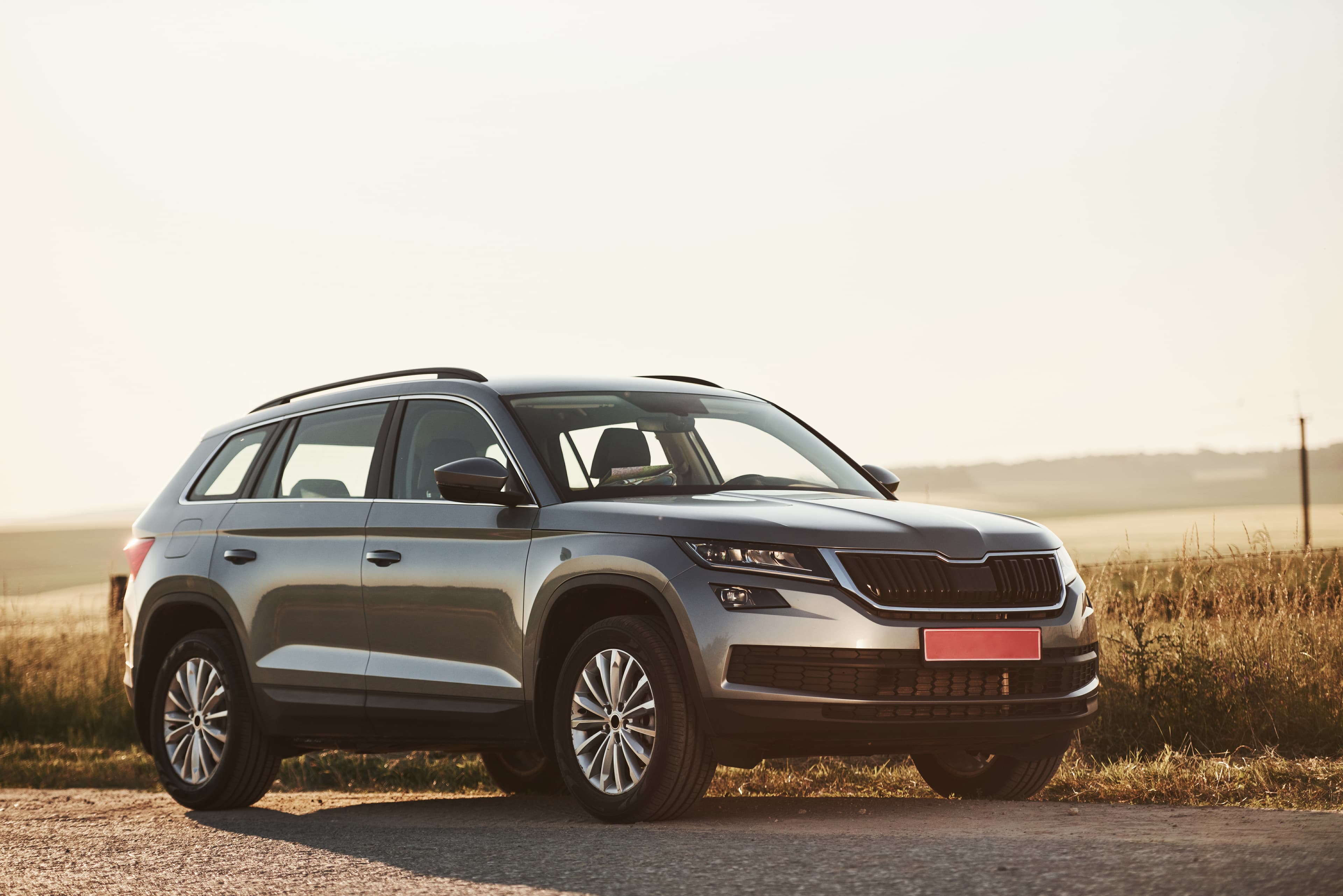 Grey sedan on a white studio background